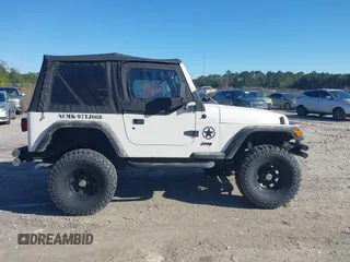 1997 Jeep Wrangler Sport with VIN 1J4FY19S7VP483735, listed as a IAAI auction lot 41469983 with 150,542 mi miles. Bid and sale history available at carsss.com. Image 13.