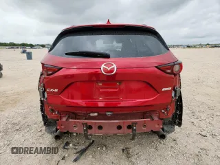 2018 Mazda CX-5 Grand Touring with VIN JM3KFADM8J0451535, listed as a Copart auction lot 59990435 with 77,163 mi miles and Salvage title. Bid and sale history available at DreamBid. Image 6.