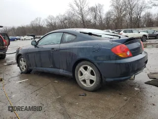 2003 Hyundai Tiburon GT z VIN KMHHN65F13U068658, wystawiony jako Copart lot #81799404 z przebiegiem 163 148 mil mil oraz Szkoda całkowita • Salvage title. Historia ofert i sprzedaży dostępna na DreamBid. Obrazek 2.