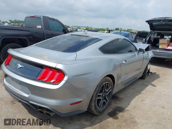2020 Ford Mustang EcoBoost z VIN 1FA6P8TH2L5186210, wystawiony jako IAAI lot #42103657 z przebiegiem 68 790 mil mil oraz . Historia ofert i sprzedaży dostępna na DreamBid. Obrazek 4.
