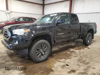 2022 Toyota Tacoma SR with VIN 3TYSX5EN6NT013141, listed as a Copart auction lot 84876824 with 29,960 mi miles and Salvage title. Bid and sale history available at DreamBid. Image 1.