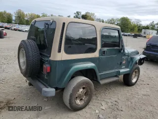 2000 Jeep Wrangler Sahara with VIN 1J4FA59S1YP747919, listed as a Copart auction lot 72278044 with 157,360 mi miles and Salvage Title. Bid and sale history available at carsss.com. Image 3.