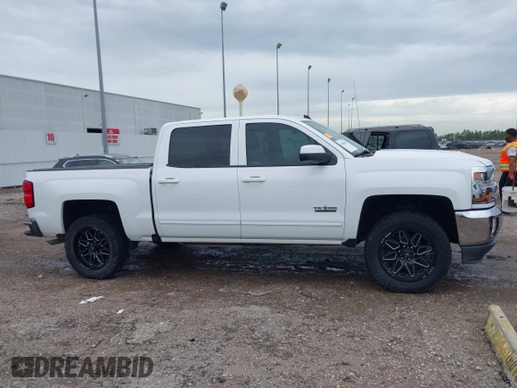 2018 Chevrolet Silverado 1500 LT with VIN 3GCPCREC7JG402401, listed as a IAAI auction lot 41880462 with 128,995 mi miles and . Bid and sale history available at DreamBid. Image 13.