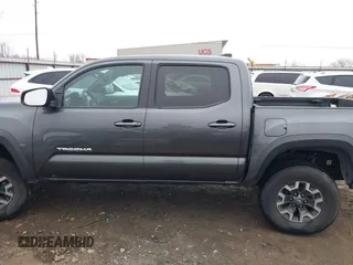 2022 Toyota Tacoma SR with VIN 3TMCZ5AN4NM476170, listed as a IAAI auction lot 41482149 with 57,126 mi miles and . Bid and sale history available at DreamBid. Image 14.