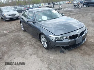2015 BMW 4 Series 428i xDrive z VIN WBA4A7C5XFD415131, wystawiony jako IAAI lot #42100618 z przebiegiem 89 093 mil mil oraz . Historia ofert i sprzedaży dostępna na DreamBid. Obrazek 1.