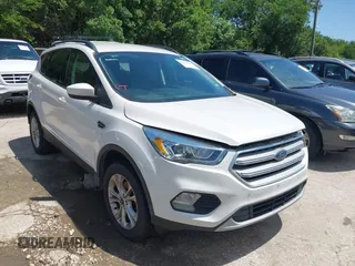 2017 Ford Escape SE z VIN 1FMCU0GD6HUE69099, wystawiony jako IAAI lot #42458673 z przebiegiem 108 961 mil mil oraz . Historia ofert i sprzedaży dostępna na DreamBid. Obrazek 1.