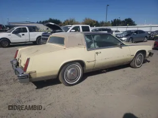 1982 Cadillac Eldorado z VIN 1G6AL578XCE608090, wystawiony jako Copart lot #73839654 z przebiegiem 22 185 mil mil oraz Czysty tytuł • Clean title. Historia ofert i sprzedaży dostępna na DreamBid. Obrazek 3.