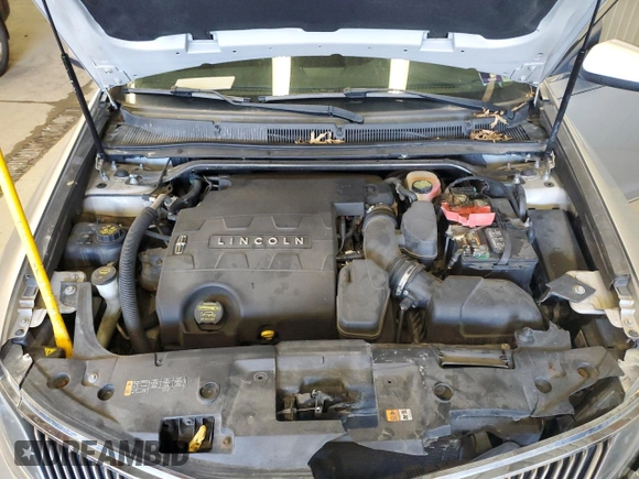 2013 Lincoln MKS z VIN 1LNHL9EK0DG605184, wystawiony jako Copart lot #51914305 z przebiegiem 173 117 mil mil oraz Szkoda całkowita • Salvage title. Historia ofert i sprzedaży dostępna na DreamBid. Obrazek 11.