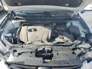 2016 Mazda CX-5 Touring z VIN JM3KE2CYXG0683673, wystawiony jako Copart lot #56724025 z przebiegiem 107 293 mil mil oraz Szkoda całkowita • Salvage title. Historia ofert i sprzedaży dostępna na DreamBid. Obrazek 12.