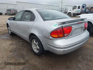 2003 Oldsmobile Alero GL1 z VIN 1G3NL52F43C169291, wystawiony jako IAAI lot #41546681 z przebiegiem 176 341 mil mil oraz . Historia ofert i sprzedaży dostępna na DreamBid. Obrazek 3.