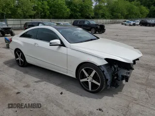 2015 Mercedes-Benz E 400 with VIN WDDKJ6HB9FF299949, listed as a Copart auction lot 56271825 with 54,446 mi miles and Salvage title. Bid and sale history available at DreamBid. Image 4.