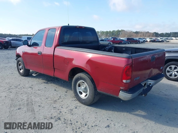 2000 Ford F-150 XL with VIN 1FTZX1729YNC32076, listed as a IAAI auction lot 41523364 with 216,726 mi miles. Bid and sale history available at carsss.com. Image 3.