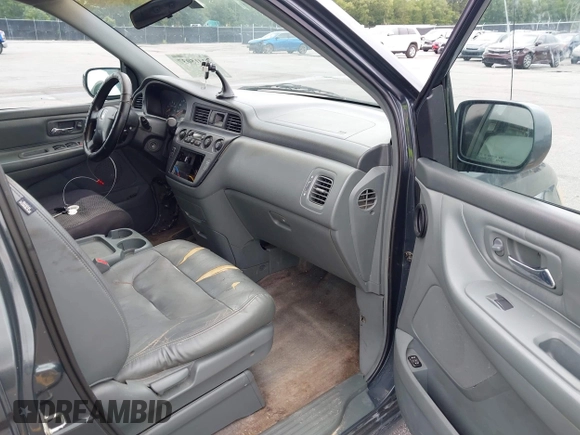 2003 Honda Odyssey EX-L with VIN 5FNRL18963B059910, listed as a IAAI auction lot 42415037 with 267,600 mi miles and . Bid and sale history available at DreamBid. Image 5.