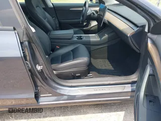 2023 Tesla Model 3 with VIN 5YJ3E1EA7PF409243, listed as a IAAI auction lot 42305360 with Not provided miles and . Bid and sale history available at DreamBid. Image 5.