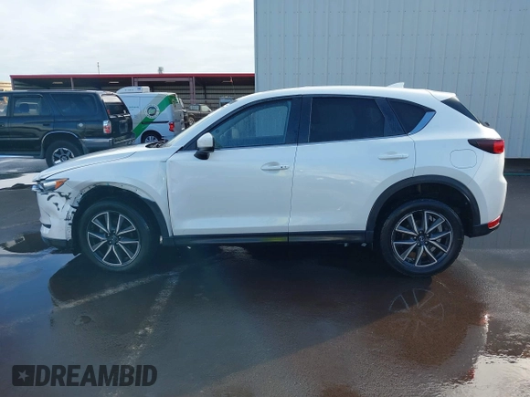 2018 Mazda CX-5 Touring with VIN JM3KFACM1J1431462, listed as a IAAI auction lot 41038099 with 77,489 mi miles. Bid and sale history available at carsss.com. Image 14.