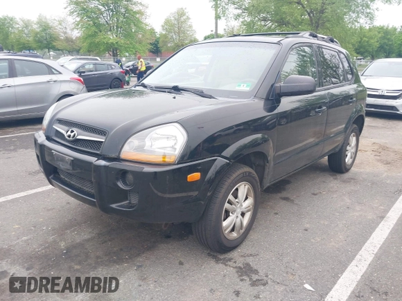 2009 Hyundai Tucson GLS with VIN KM8JM12B59U990027, listed as a IAAI auction lot 42195935 with 170,875 mi miles. Bid and sale history available at carsss.com. Image 2.