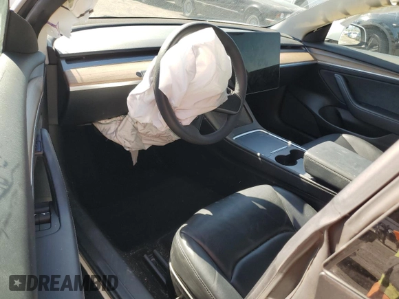 2023 Tesla Model 3 z VIN 5YJ3E1EA5PF401240, wystawiony jako Copart lot #56548895 z przebiegiem 25 188 mil mil oraz Szkoda całkowita • Salvage title. Historia ofert i sprzedaży dostępna na DreamBid. Obrazek 8.