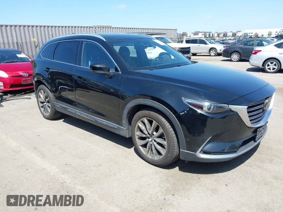 2016 Mazda CX-9 Grand Touring with VIN JM3TCBDY4G0113693, listed as a IAAI auction lot 41965857 with 152,403 mi miles and . Bid and sale history available at DreamBid. Image 1.