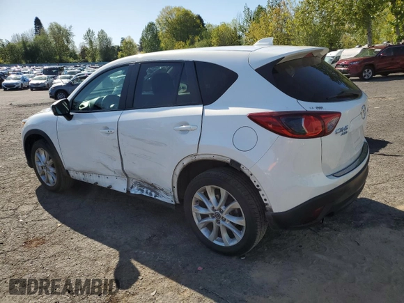 2014 Mazda CX-5 Grand Touring with VIN JM3KE4DY2E0354795, listed as a Copart auction lot 54205775 with 62,939 mi miles and Salvage Title. Bid and sale history available at DreamBid. Image 2.