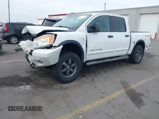2014 Nissan Titan Pro-4X with VIN 1N6BA0ECXEN501915, listed as a IAAI auction lot 42097967 with 120,851 mi miles and . Bid and sale history available at DreamBid. Image 17.