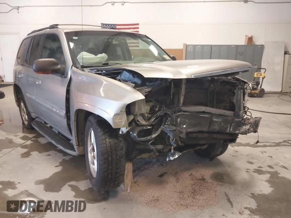 2003 GMC Envoy SLT z VIN 1GKDS13S932299354, wystawiony jako IAAI lot #41238557 z przebiegiem 251 535 mil mil oraz . Historia ofert i sprzedaży dostępna na DreamBid. Obrazek 6.