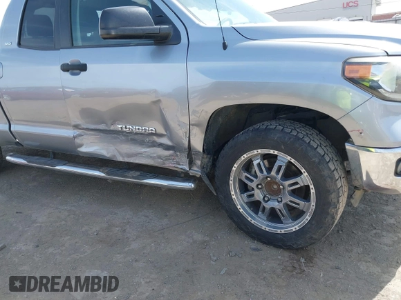 2018 Toyota Tundra 2WD SR with VIN 5TFRM5F16JX133735, listed as a IAAI auction lot 41818455 with 148,456 mi miles. Bid and sale history available at carsss.com. Image 6.