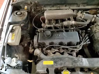 1997 Hyundai Accent z VIN KMHVD14NXVU221266, wystawiony jako Copart lot #86383044 z przebiegiem 159 517 mil mil oraz Szkoda całkowita • Salvage title. Historia ofert i sprzedaży dostępna na DreamBid. Obrazek 13.