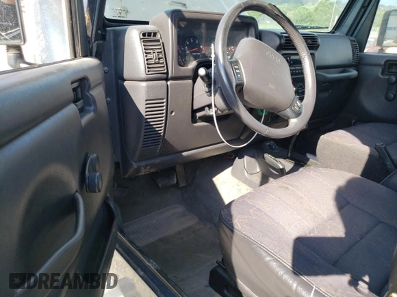 2002 Jeep Wrangler Sport с VIN 1J4FA49S02P734712, выставлен на аукционе Copart как лот 63310225 с пробегом 178 367 миль миль и Чистый • Clean title. История ставок и продаж доступна на DreamBid. Изображение 8.