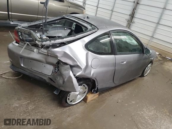 2000 Honda Insight with VIN JHMZE1376YT000164, listed as a Copart auction lot 53851695 with 72,940 mi miles and Salvage title. Bid and sale history available at DreamBid. Image 3.