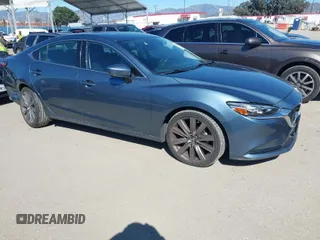 2018 Mazda 6 Grand Touring with VIN JM1GL1TY4J1333021, listed as a IAAI auction lot 41818719 with 56,188 mi miles and . Bid and sale history available at DreamBid. Image 1.