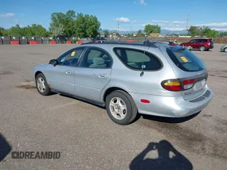 1996 Ford Taurus GL z VIN 1FALP57U9TG184497, wystawiony jako IAAI lot #42290105 z przebiegiem 149 155 mil mil oraz . Historia ofert i sprzedaży dostępna na DreamBid. Obrazek 3.