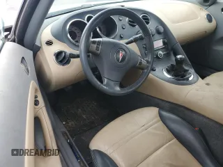 2006 Pontiac Solstice z VIN 1G2MB33B56Y106095, wystawiony jako Copart lot #52068765 z przebiegiem Nie podano mil oraz Szkoda całkowita • Salvage title. Historia ofert i sprzedaży dostępna na DreamBid. Obrazek 8.