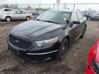2013 Ford Sedan Police Interceptor with VIN 1FAHP2M89DG162643, listed as a IAAI auction lot 42088765 with 119,386 mi miles. Bid and sale history available at carsss.com. Image 2.