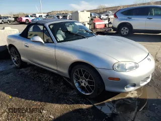 2004 Mazda MX-5 Miata LS with VIN JM1NB353640402308, listed as a Copart auction lot 84568244 with 50,287 mi miles and Salvage title. Bid and sale history available at DreamBid. Image 4.