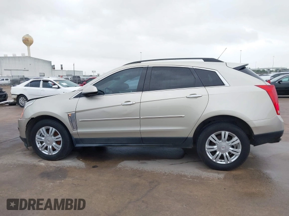 2015 Cadillac SRX z VIN 3GYFNAE37FS597695, wystawiony jako IAAI lot #42184666 z przebiegiem 106 210 mil mil oraz . Historia ofert i sprzedaży dostępna na DreamBid. Obrazek 14.