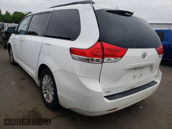 2011 Toyota Sienna XLE AAS with VIN 5TDYK3DCXBS063948, listed as a Copart auction lot 59776695 with 305,799 mi miles and Salvage title. Bid and sale history available at DreamBid. Image 2.