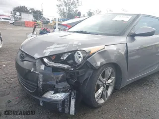 2012 Hyundai Veloster w/Gray Int with VIN KMHTC6AD3CU053230, listed as a IAAI auction lot 41570600 with 125,210 mi miles. Bid and sale history available at carsss.com. Image 6.
