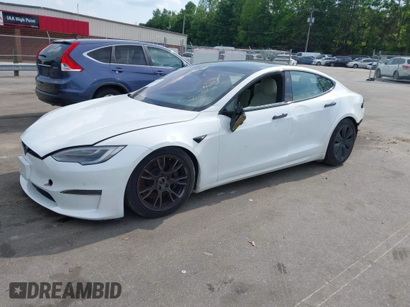 2022 Tesla Model S with VIN 5YJSA1E57NF462175, listed as a IAAI auction lot 42231439 with Not provided miles and . Bid and sale history available at DreamBid. Image 2.
