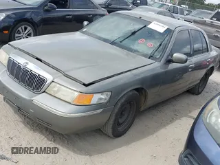 1999 Mercury Grand Marquis GS z VIN 2MEFM74W4XX631219, wystawiony jako IAAI lot #42096304 z przebiegiem 267 738 mil mil oraz . Historia ofert i sprzedaży dostępna na DreamBid. Obrazek 2.