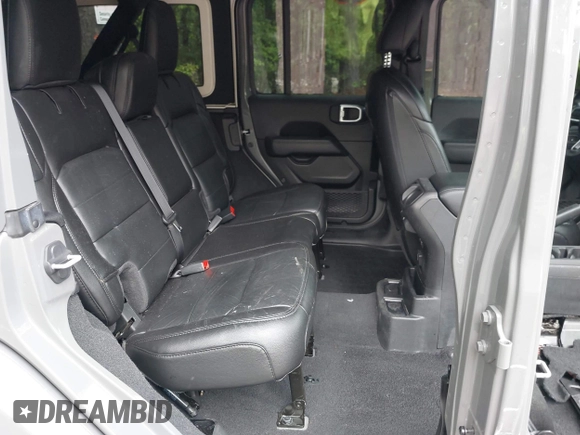 2021 Jeep Wrangler Unlimited Sahara with VIN 1C4HJXEG0MW703812, listed as a IAAI auction lot 42186089 with 50,349 mi miles and . Bid and sale history available at DreamBid. Image 8.