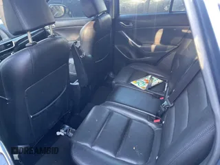 2016 Mazda CX-5 Grand Touring with VIN JM3KE4DY9G0673789, listed as a IAAI auction lot 42196841 with 98,622 mi miles and . Bid and sale history available at DreamBid. Image 8.
