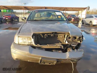 2005 Ford Crown Victoria LX with VIN 2FAFP74W55X130190, listed as a IAAI auction lot 41138306 with 122,738 mi miles. Bid and sale history available at carsss.com. Image 11.