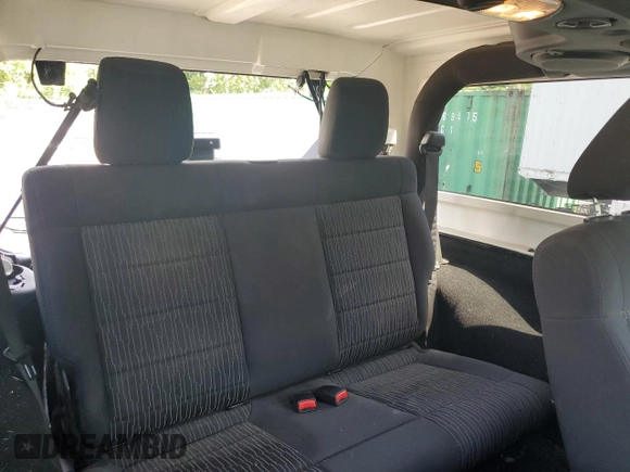 2012 Jeep Wrangler Sport with VIN 1C4AJWAG6CL256792, listed as a Copart auction lot 62634515 with 137,507 mi miles and Salvage title. Bid and sale history available at DreamBid. Image 11.