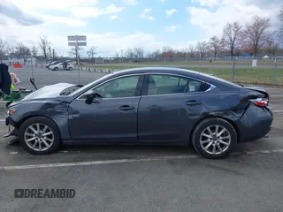 2014 Mazda 6 i Sport with VIN JM1GJ1U51E1111018, listed as a IAAI auction lot 41875461 with 253,755 mi miles and . Bid and sale history available at DreamBid. Image 14.