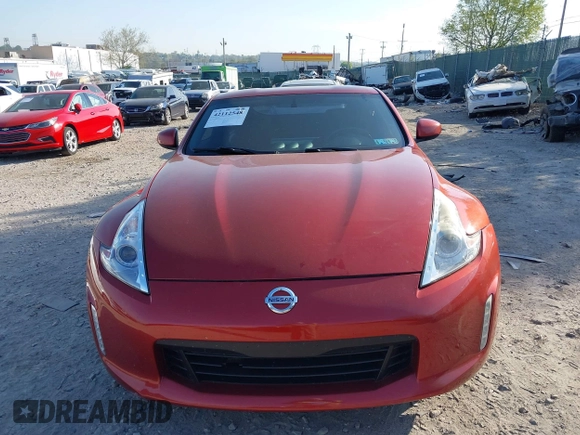 2014 Nissan 370Z Nismo with VIN JN1AZ4EH9EM636340, listed as a IAAI auction lot 42112548 with 143,894 mi miles and . Bid and sale history available at DreamBid. Image 13.