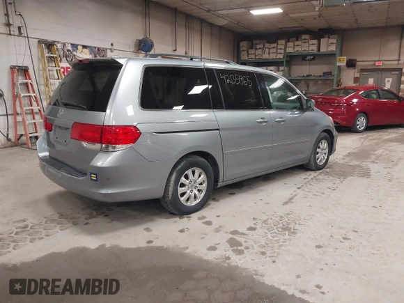 2009 Honda Odyssey EX-L with VIN 5FNRL38789B015524, listed as a IAAI auction lot 42135465 with 242,005 mi miles. Bid and sale history available at carsss.com. Image 4.