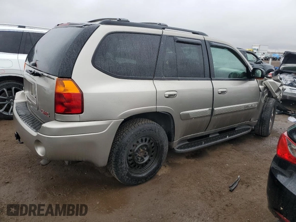 2002 GMC Envoy SLT with VIN 1GKDT13S222296226, listed as a Copart auction lot 51599295 with 148,653 mi miles and Salvage Title. Bid and sale history available at carsss.com. Image 3.