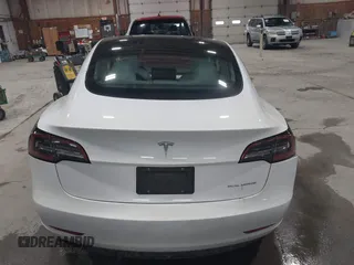 2021 Tesla Model 3 Long Range with VIN 5YJ3E1EBXMF051060, listed as a IAAI auction lot 41958018 with 65,631 mi miles. Bid and sale history available at carsss.com. Image 16.