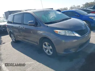 2014 Toyota Sienna LE AAS with VIN 5TDKK3DC6ES521706, listed as a IAAI auction lot 41999188 with 104,867 mi miles. Bid and sale history available at carsss.com. Image 1.