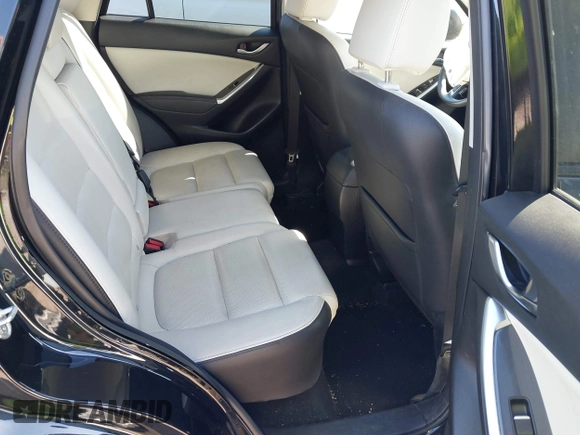 2016 Mazda CX-5 Grand Touring with VIN JM3KE4DY4G0677605, listed as a IAAI auction lot 41642893 with Not Provided miles and . Bid and sale history available at carsss.com. Image 8.